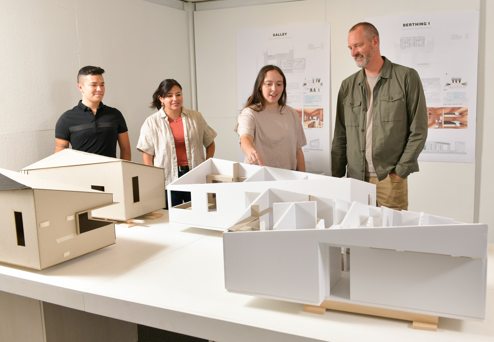 Sommerfeld and students discuss building models. From left to right: Antonio Valencia, Paola Larios, Caitlin Kennedy and Rick Sommerfeld