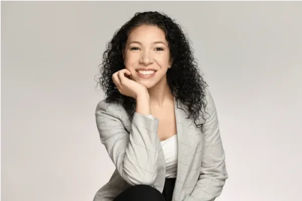 Adelita Aguirre in a gray blazer against a gray background